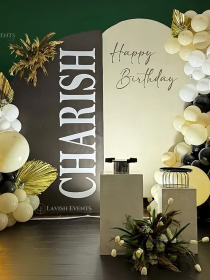Another angle of the modern boho setup, showing how the neutral-colored balloons complement the black and white design elements.