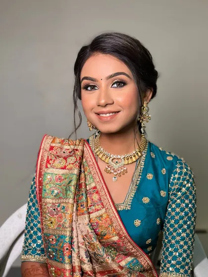 A soft and simple updo for a Mandwa ceremony. This look is understated yet elegant, perfect for pre-wedding rituals.
