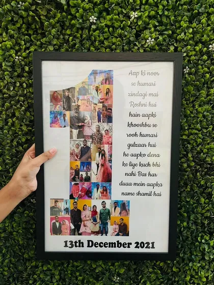 We turn your memories into art with our personalized photo frames. For this first anniversary gift, we created a collage of the couple's photos inside the number '1', placed alongside a heartfelt message and their special date.