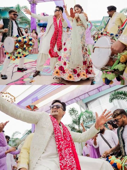 The couple makes a grand entrance with dhol players, dancing their way into the Haldi celebration.