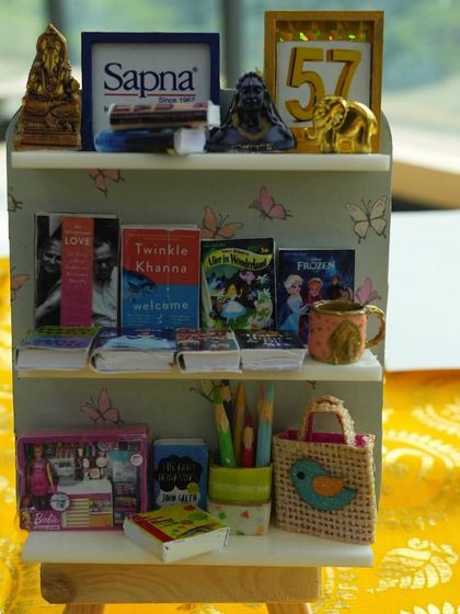 A closer look at the incredible detail in our miniature bookshelf workshop. Every tiny book and accessory is carefully crafted and placed, making for a truly special and personalized piece of art.