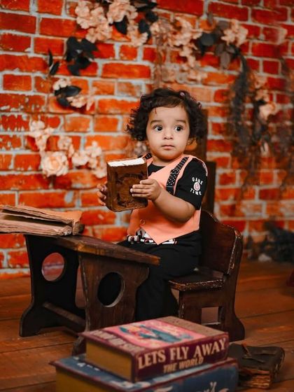 A gallery of our popular school and library theme. These images show the versatility of the brick wall backdrop, mini school desk, globe, and book props for creating a variety of scholarly and classic portraits.