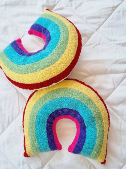 The vibrant version of our new rainbow cushions. The bright colors are sure to bring joy and energy to any child's space.