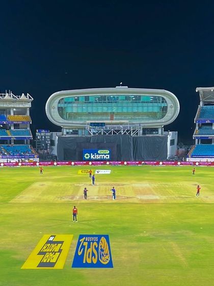 A wide view of the Saurashtra Cricket Association Stadium during an SPL match. This showcases the complete on-field setup, including pitch markings and branding, that we manage.