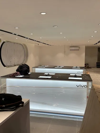 A Vivo store during the final fit-out, with protective plastic still on the counters. This is a crucial phase where we install high-value fixtures and ensure they remain in perfect condition.