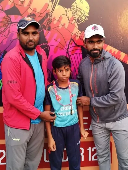Aditya Dayma being awarded for his excellent bowling.