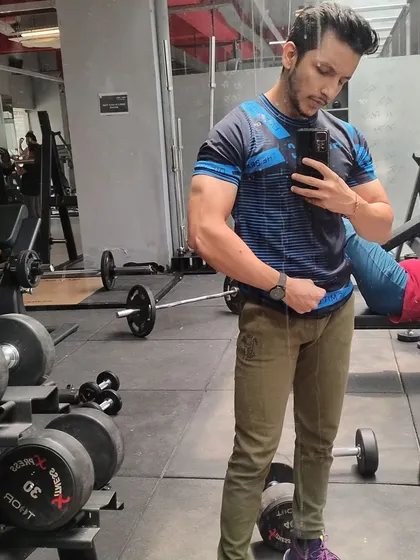 Feeling strong after a leg day session that included 100kg squats. A solid lower body is the foundation of a powerful physique.