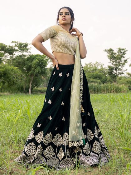 This full-length shot shows how the makeup balances with the elaborate lehenga, creating a complete and impactful fashion statement.