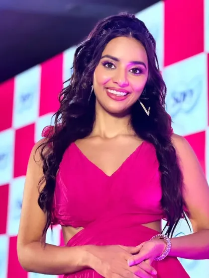 This look was for a fun and vibrant event. I used bright pink tones in her makeup to match her dress, with a focus on radiant skin and a glossy lip. Her hair was styled in modern, beachy waves for a fresh and youthful feel.