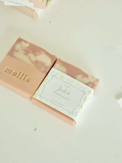 The custom tags and packaging for the Amsterdam-bound baby shower favors.
