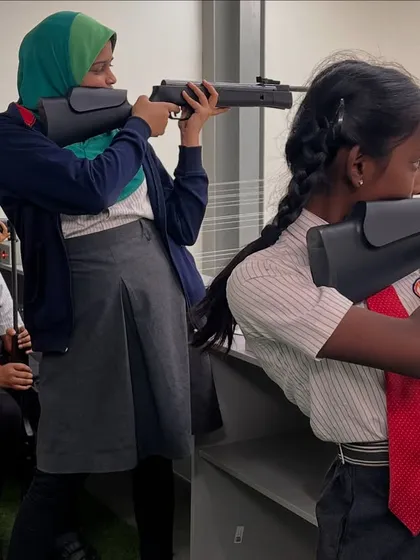 Young shooters at BS International School receiving instruction during a training session. We are committed to nurturing talent right from the school level.