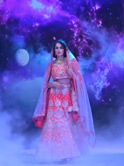 A celestial moment on the runway. This pink and gold lehenga, set against a cosmic backdrop, showcases the fairytale quality I love to bring to my traditional designs.