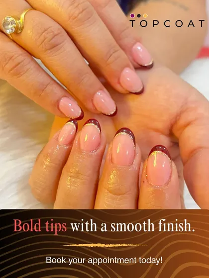 A subtle and chic take on Christmas nails. This design features a modern French manicure with deep red tips and a delicate gold line for a touch of festive elegance.
