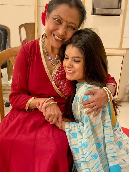 Every step I take is guided by the blessings of my gurus. This precious moment with my guru, Saswati Sen ji, captures the essence of the 'guru-shishya parampara' that is the foundation of my art and my life. Her faith in me is my greatest strength.