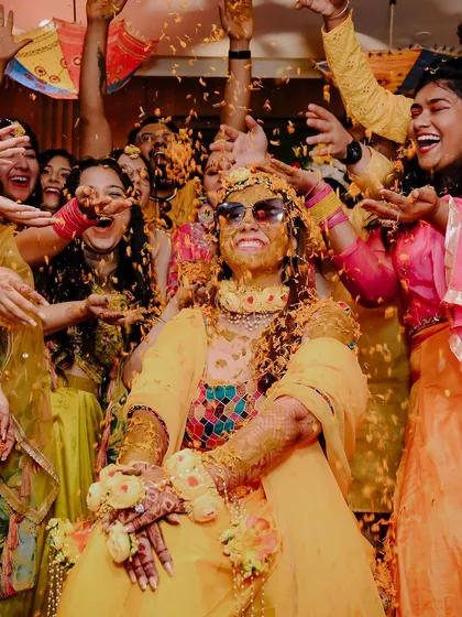 Pure joy and chaos at Pragya's haldi ceremony. These are the moments you'll look back on and laugh about for years. My goal is to be right in the middle of the fun, capturing the genuine smiles and playful moments with friends and family.