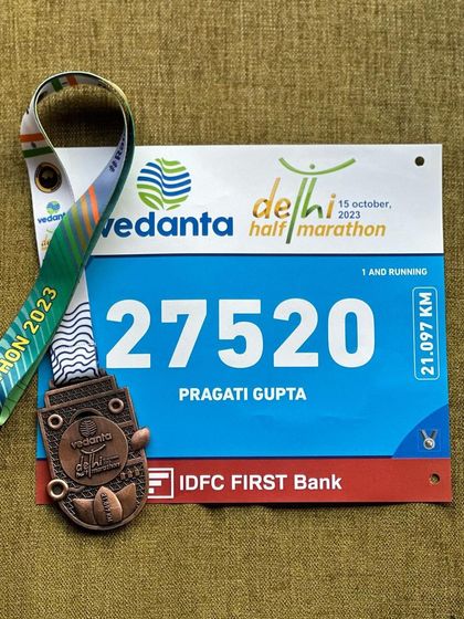 A duplicate of image 108. The bib and medal from the Vedanta Delhi Half Marathon. A reminder of a tough but rewarding race.