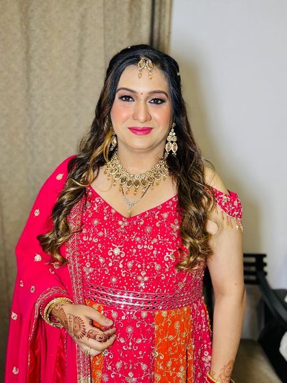 A vibrant party look in a pink and orange anarkali.