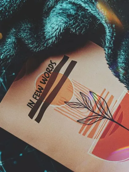 Creating a cozy and comfortable vibe for the book by pairing it with a soft blanket. The added light flare gives the image a dreamy, magical quality, perfect for a different kind of brand mood.