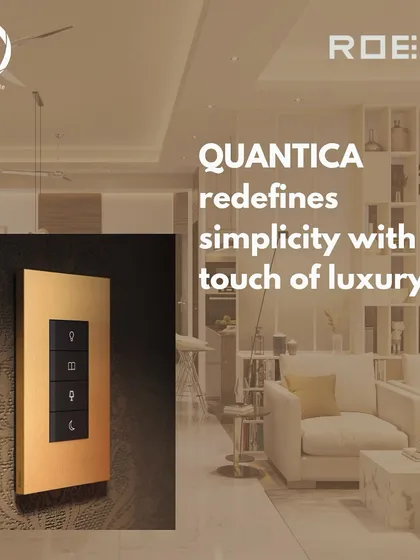 The Roehn QUANTICA keypad in a luxurious gold finish, mounted on a dark textured wall in a modern living room, redefining simplicity with a touch of luxury.