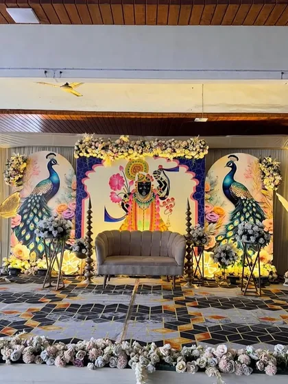For a traditional Godh Bharai ceremony, I designed this stunning stage featuring Lord Krishna (Shrinathji) and peacock illustrations, blending cultural reverence with beautiful aesthetics.