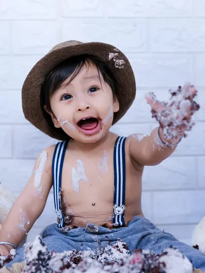 Nothing says "Happy First Birthday" like a cake smash! We capture the pure, messy joy as your little one dives into their first cake, creating hilarious and sweet memories.