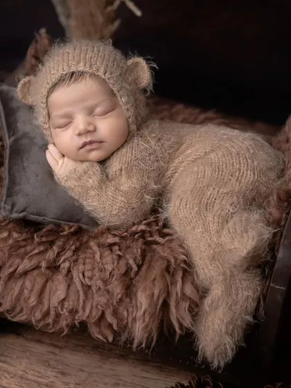 A different angle of our teddy bear newborn, sleeping soundly next to his tiny friend.
