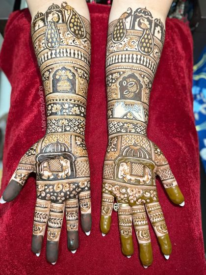 A clear, top-down view of the royal elephant bridal mehendi, showing the symmetry and the combination of different traditional patterns.