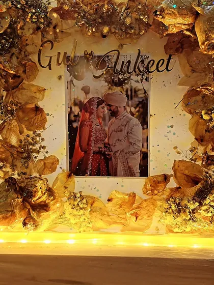 And it's here. A beautiful resin frame with preserved varmala and LED lights to make it glow. Many congratulations to the happy couple.
