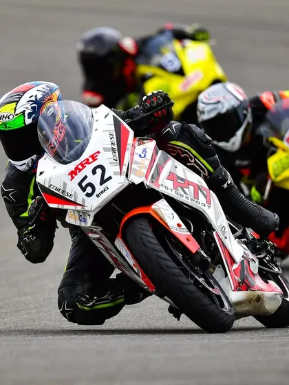 This is the heart of racing: close battles and pushing your limits. Here, our rider Swaroop is fighting for position in a packed field during an INMRC race. We thrive on this intensity and coach our riders to navigate these moments with skill and strategy.