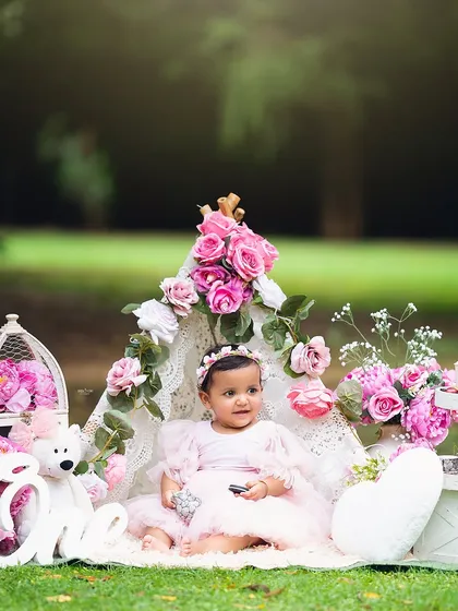 Sitting pretty for her first birthday portrait in the park.