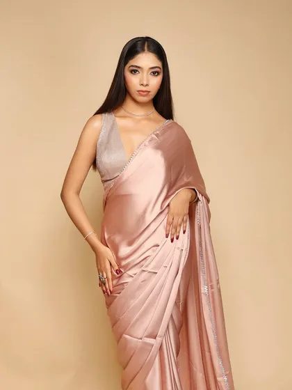 A clean, elegant shot for a saree brand against a seamless beige backdrop. This is a classic e-commerce setup that we can provide for any apparel business.