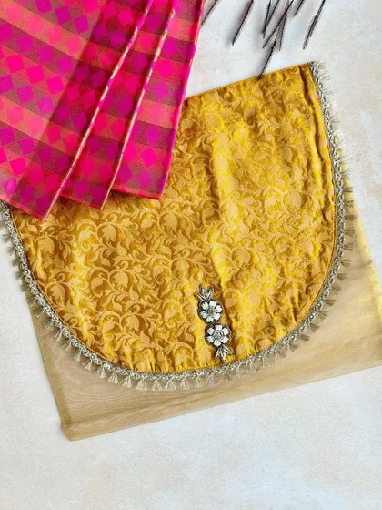 A closer look at one of my favorite saree covers. The rich yellow brocade flap contrasts beautifully with the sheer net base, and the crystal embellishments add a touch of sparkle.