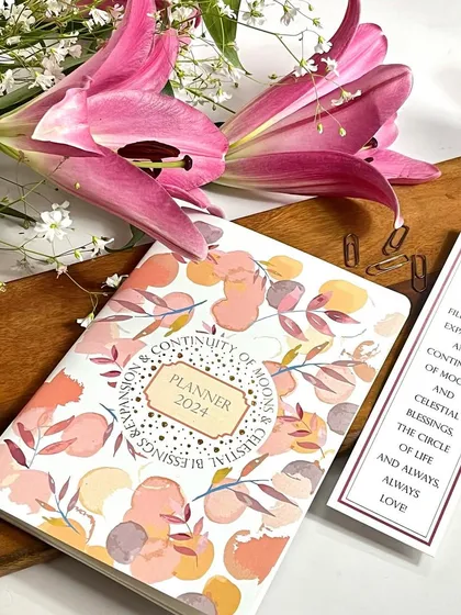 Our 2024 monthly planner with the 'Continuity of Moons' design. The cover is beautifully printed with gold foil, adding a touch of magic to your year.