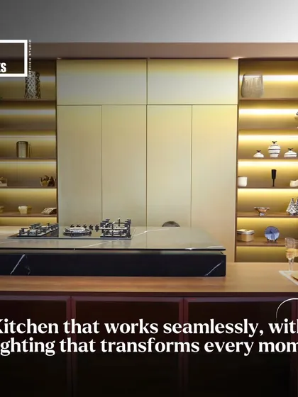 Lighting can transform a space. In this design, illuminated open shelves and under-cabinet lighting create a warm, inviting glow and highlight decorative items.