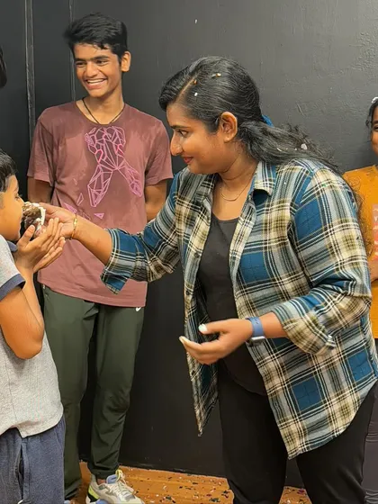 Sharing a piece of birthday cake with one of our younger members. It's all about creating happy memories together.