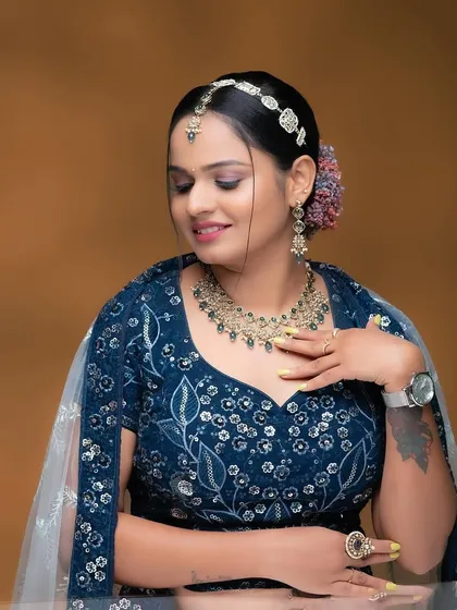 This client is ready for a party in a blue lehenga and a stylish Kundan and pearl choker set. This is a great rental option for attending a wedding or a festive event.