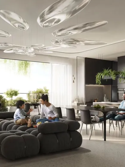 The interior of a Sky Gardens apartment, where open-plan living spaces flow seamlessly onto a large, green balcony. This design combines the luxury of villa living with the convenience of a condominium.