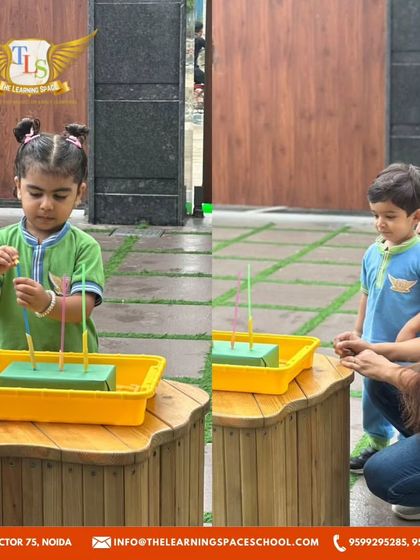 A teacher guides a child through a morning activity. One-on-one interaction helps us tailor the learning experience to each child's individual needs and pace.