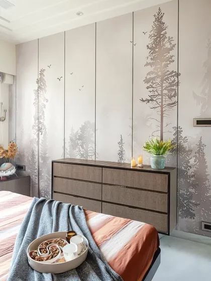Here, the focus is on the serene, forest-themed wallpaper that serves as a calming backdrop for the chest of drawers. This feature wall brings a touch of the outdoors inside, enhancing the room's role as a peaceful sanctuary.