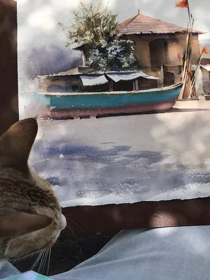 My new friend appears to be inspecting the final details of the painting. It was a memorable experience.