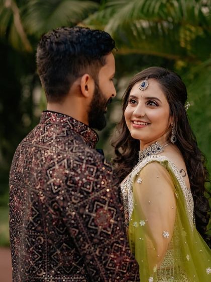 A sweet moment between Sheetal and her partner during her sangeet. Her makeup is designed to look romantic and beautiful in candid shots.