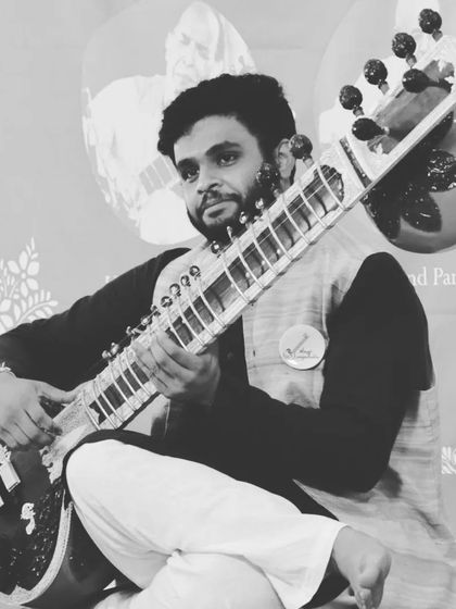 Another black and white photo from the Gurupoornima concert, capturing the classic and timeless nature of the event.