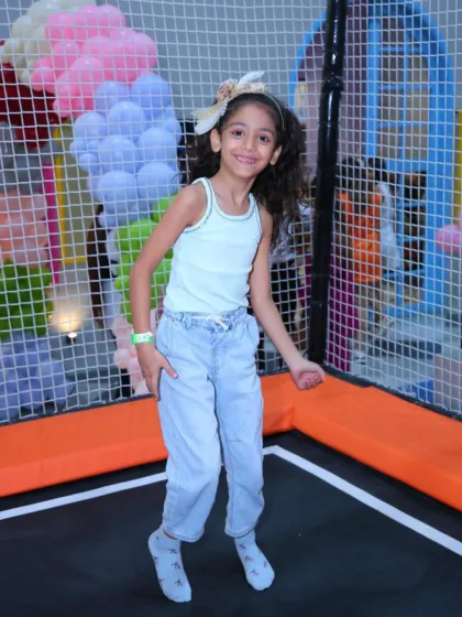 A joyful jump! This girl is having a fantastic time bouncing in our trampoline park, a place filled with endless energy and smiles.
