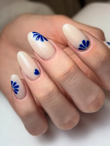 A variation of the minimal cobalt blue design, with a tiny blue heart accent nail for a sweet, personal touch.