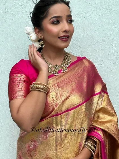 A festive look for Diwali. The golden hour light perfectly complements the warm tones in the makeup and the beautiful pink and gold silk saree.