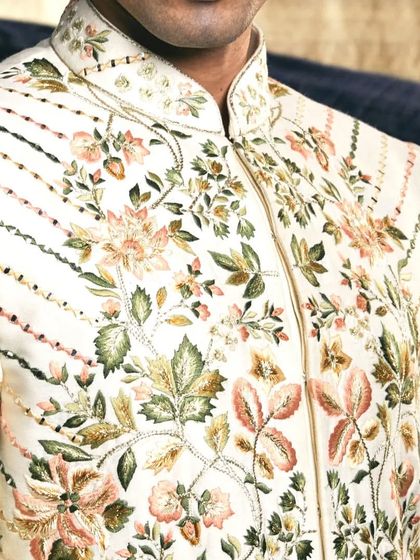 Every element, from the collar to the cuffs, is meticulously designed and embroidered to contribute to a cohesive and magnificent wedding ensemble.