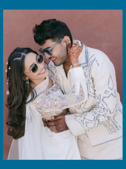 A stylish and cool portrait of Rahul and Krina. Their modern outfits and confident embrace make for a standout engagement shot.