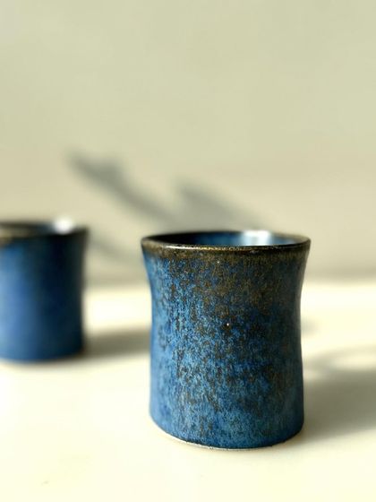 A close-up of our cobalt blue cups. The glaze has a beautiful, speckled texture that feels wonderful to hold.