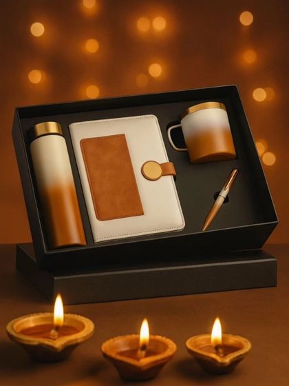 Here is the cream and brown version of the four-piece gift set, shown in a festive setting. All four items, the bottle, diary, mug, and pen, can be customized with a name or logo.