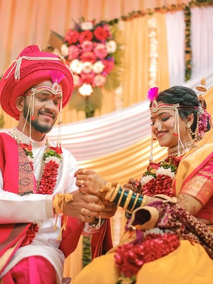 The couple holds hands during their wedding ceremony, a simple yet powerful symbol of their union. I focus on capturing these meaningful gestures.